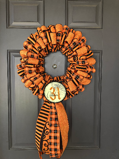 Black and Orange Ribbon October 31st Halloween Wreath on Gray Door