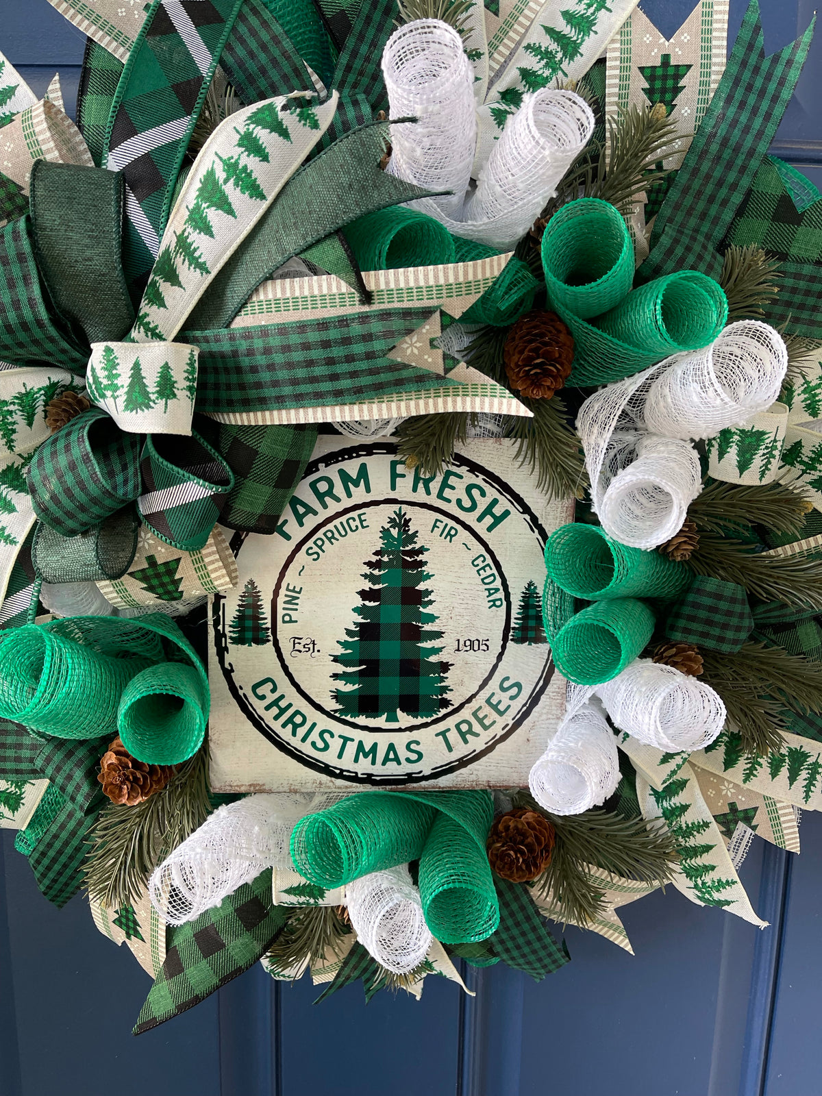 White, Green and Black Deco Mesh Farm Fresh Christmas Wreath on a blue door.