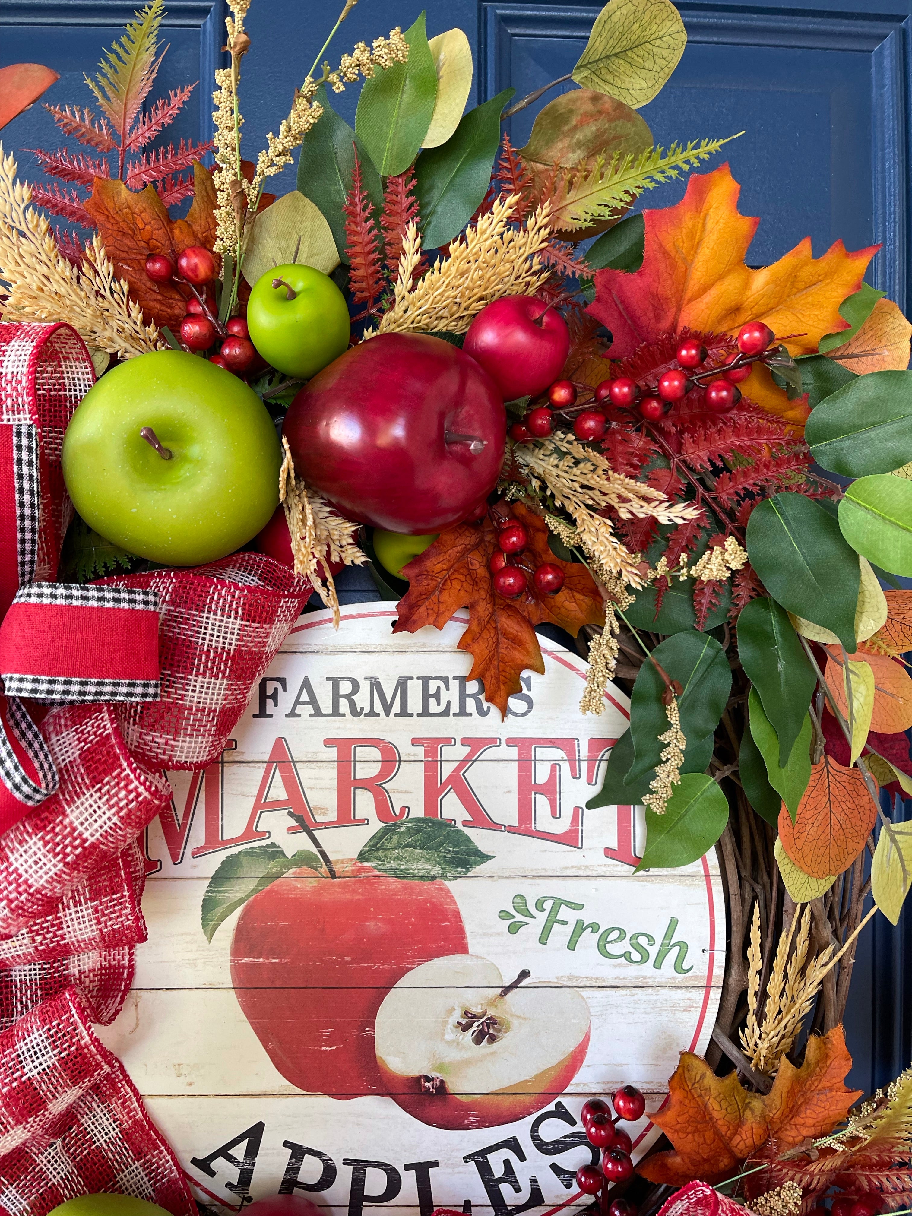 Close Up of Red and Green Small and Large Apples, Fall Leaves, Berries on a Grapevine Wreath with a Farmers Market Fresh Apple Sign