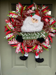 Santa Claus Plush Workshop Red, White and Green Workshop Wreath on a Green Front Door