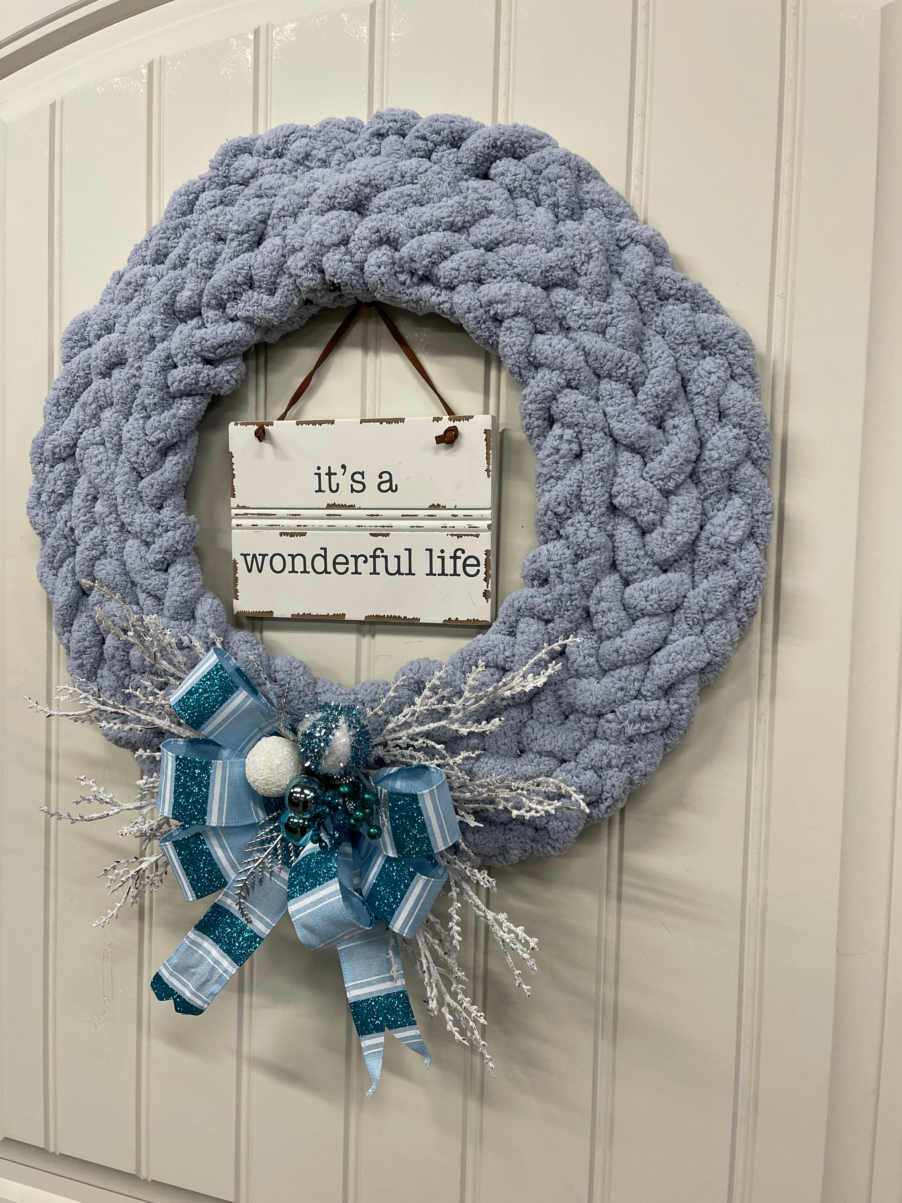 Right Side View of Blue Gray Chenille Yarn Braided Winter It's A Wonderful Life Wreath on a White Door
