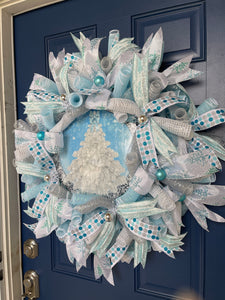 Right Side View of Blue and White Deco Mesh Winter Christmas Tree Wreath on a Blue Door 