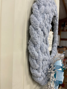 Side View of Blue Gray Chenille Yarn Braided Winter It's A Wonderful Life Wreath on a White Door
