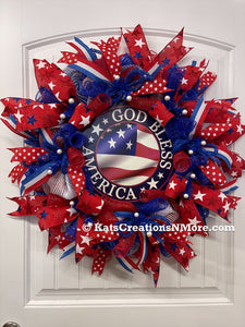 Red, White and Blue Stars and Stripes, God Bless America Deco Mesh Wreath on a White Door