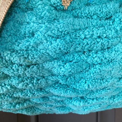 Close up of Woven Chenille Blue Yarn on the Pumpkin Wreath 