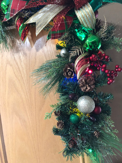 closeup of the multi-colored light Christmas garland and corner swag