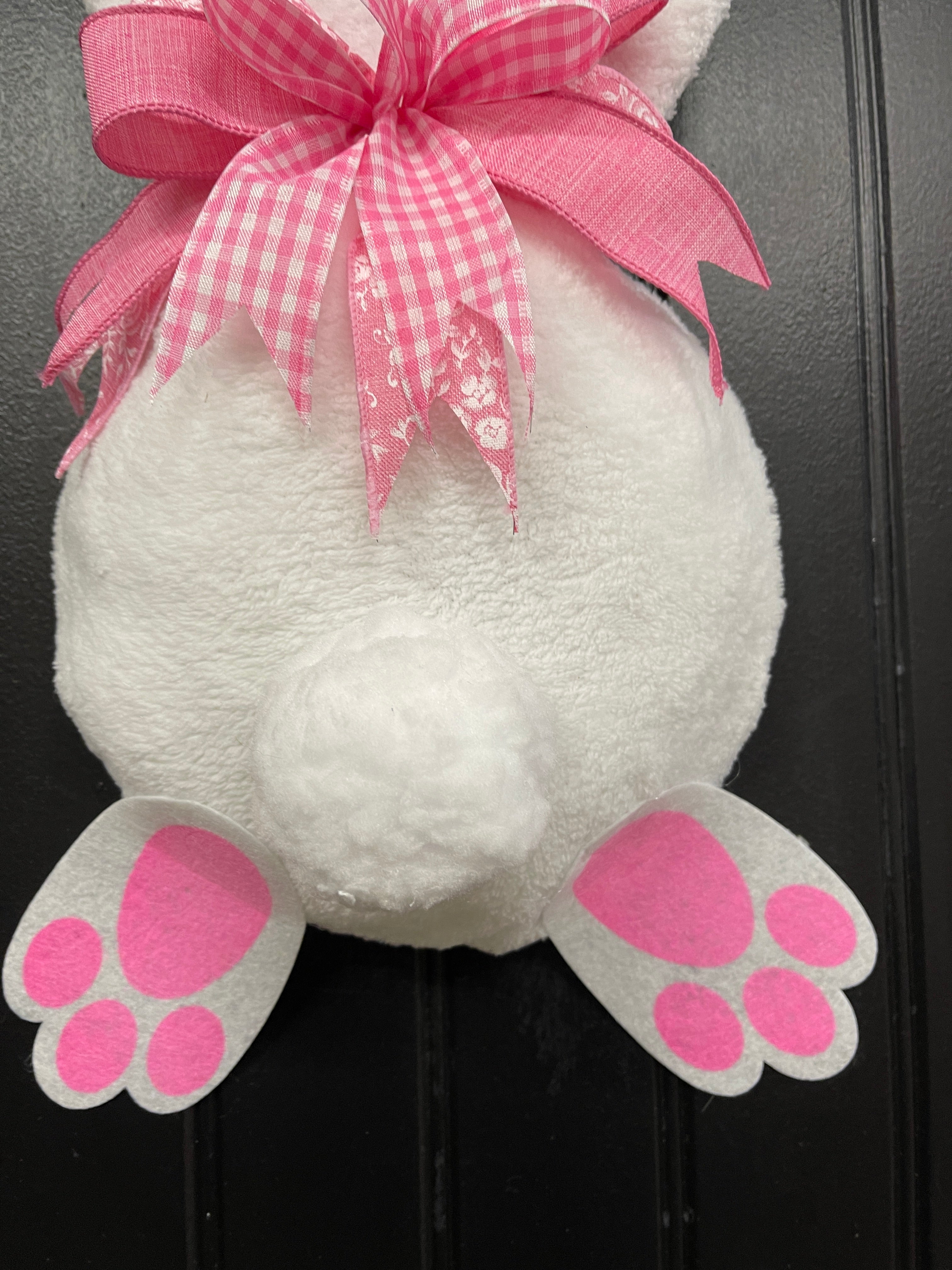 Close Up of White Cotton Tail on a Bunny Butt Wreath  with a pink and white bow and pink and white paws
