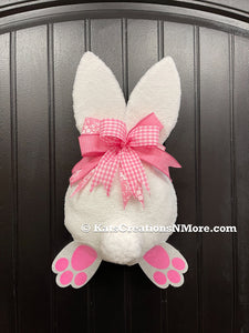 Pink and White Fabric Plush Bunny Butt Wreath with a Pink and White Bow on a Black Door