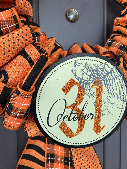 Close Up of Circle October 31st Sign on Halloween Wreath