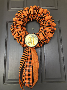 Bottom View of Black and Orange Ribbon October 31st Halloween Wreath on Gray Door