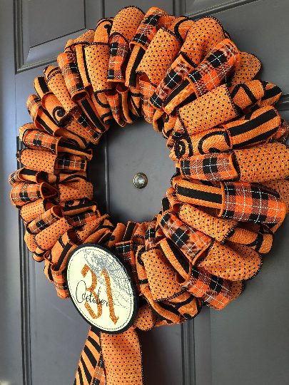 Right Side view of Black and Orange Ribbon October 31st Halloween Wreath on Gray Door