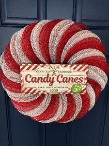 candy cane Christmas wreath seen hanging on door