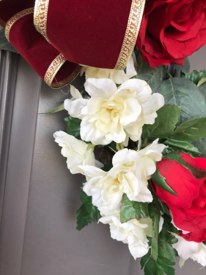 Close Up Details of Red Roses and White Delphinium Florals