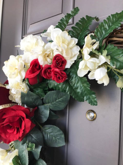 Close Up Details of Red Roses and White Delphinium Florals on a Grapevine Wreath