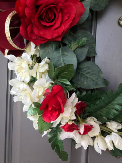 Close Up Details of Red Roses and White Delphiniums
