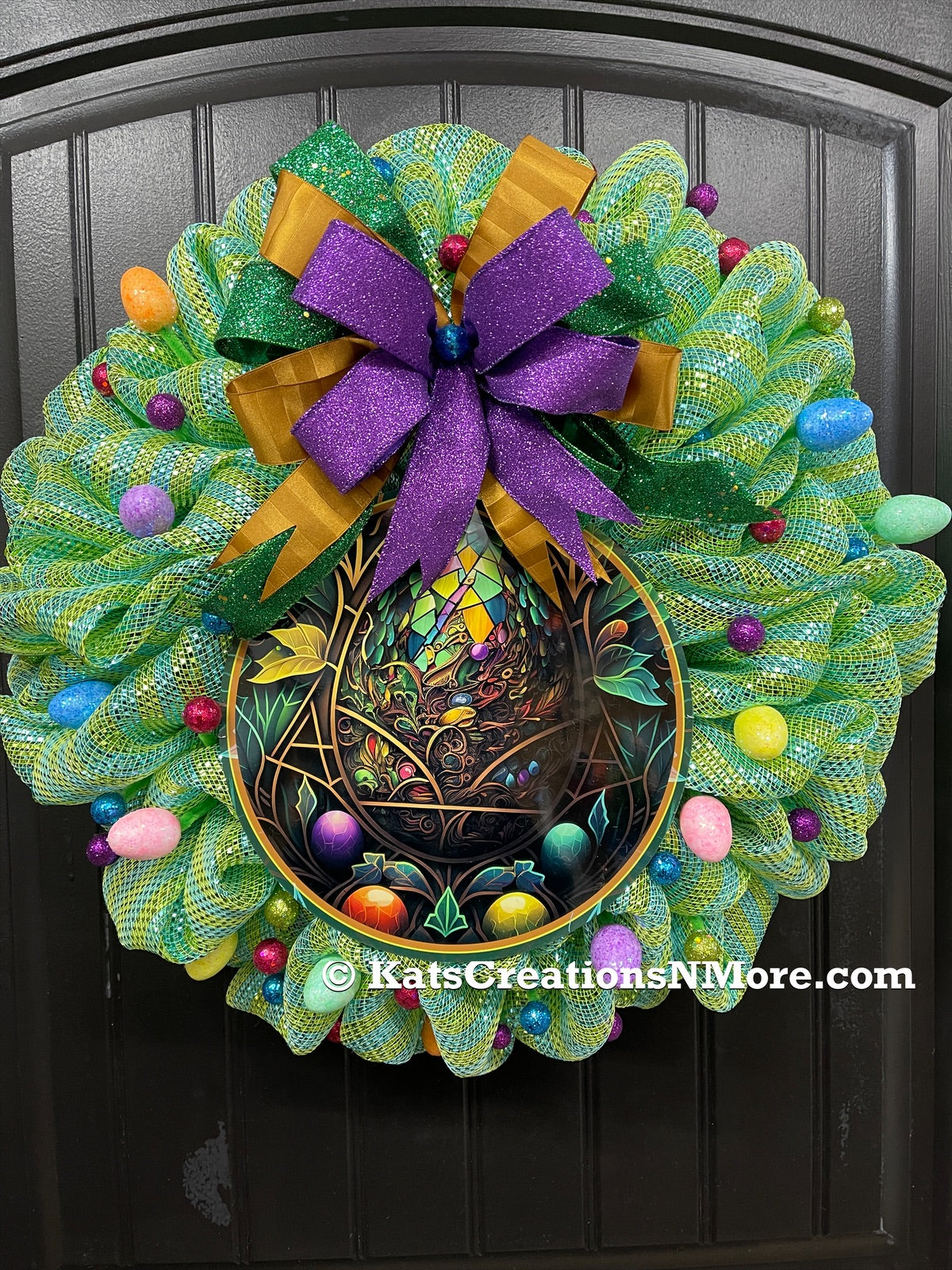 Stained Glass Look Easter Egg Bubble Deco mesh Wreath with a Bow with Glitter Balls and Eggs on a Black Door