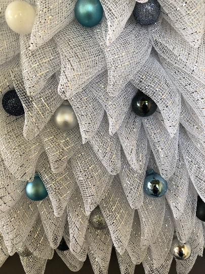 Close Up Detail of White, Gray and Blue Christmas Balls on a Deco Mesh Christmas Wreath