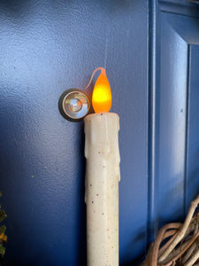 Close up of Tapered Tip of Artificial Candle on a Grapevine Wreath