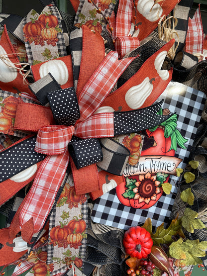 Close Up Details of Fall Bow featuring Black, White, Orange and Tan Ribbons, Autumn Thyme Sign and Artificial Pumpkins and Squash on a Fall Wreath