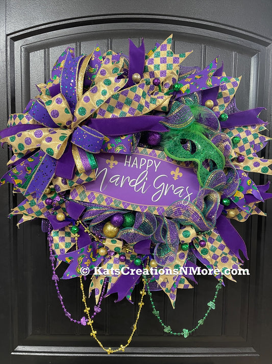 Purple, Green and Gold Mardi Gras Wreath with Beads, Balls, Mask and Bow on a Black Door