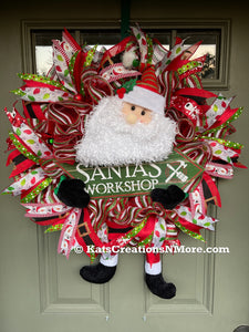 Santa Claus Plush Workshop Red, White and Green Workshop Wreath on a Green Front Door