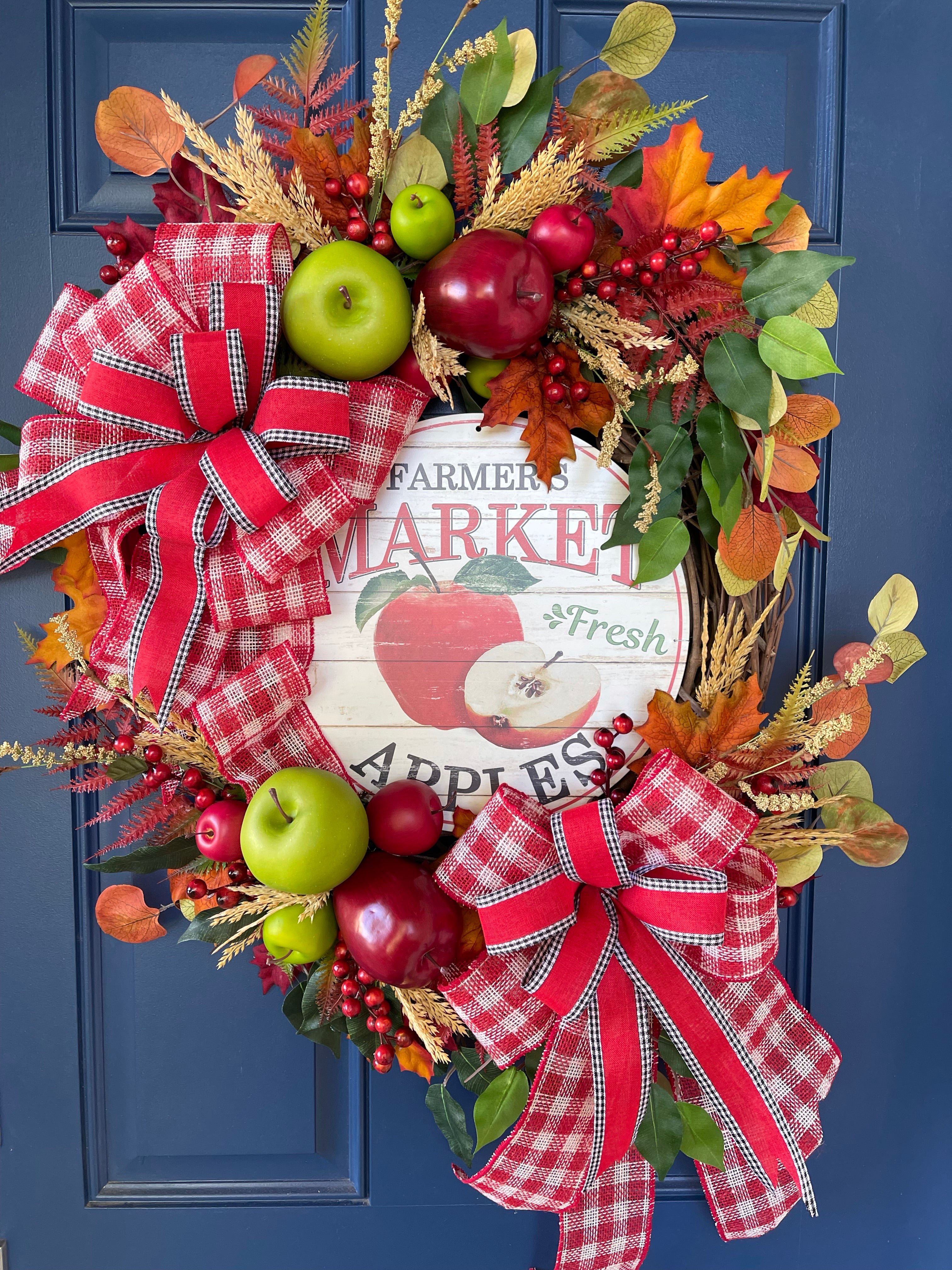Fall Apple Grapevine Wreath filled with Red and Green Apples, Fall Leaves and Berries, Double Bows of Red, White and Black with a Farmers Market Fresh Apples Sign in the Center. 