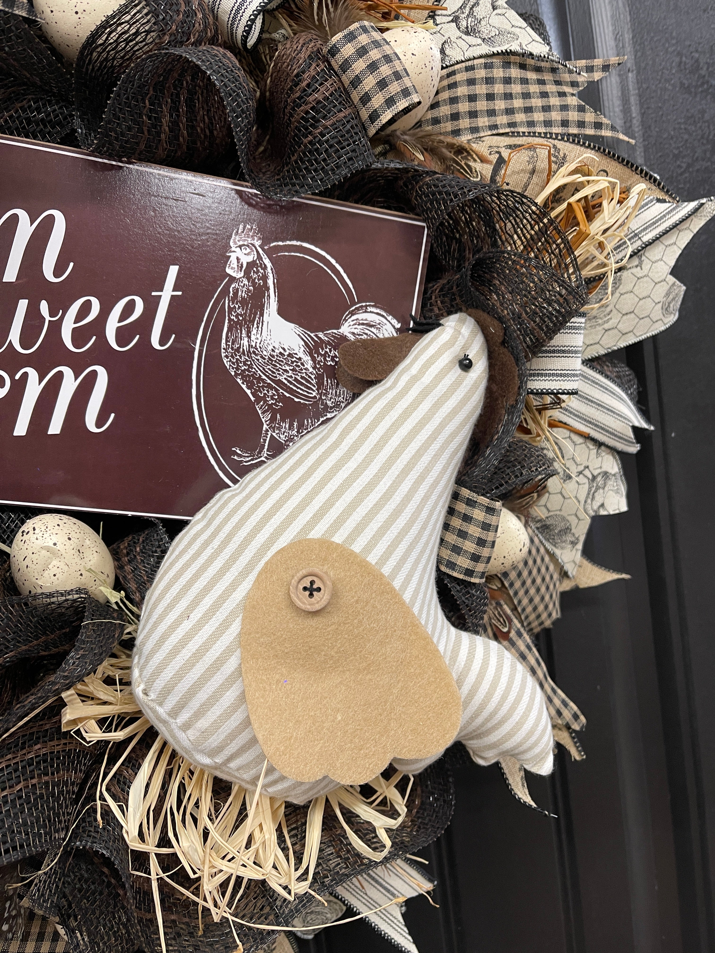 Plush Beige and White Striped Chicken with Felt Wings on a Black, White, Brown and Beige Farm Sweet Farm Chicken Egg Wreath on a Black Door