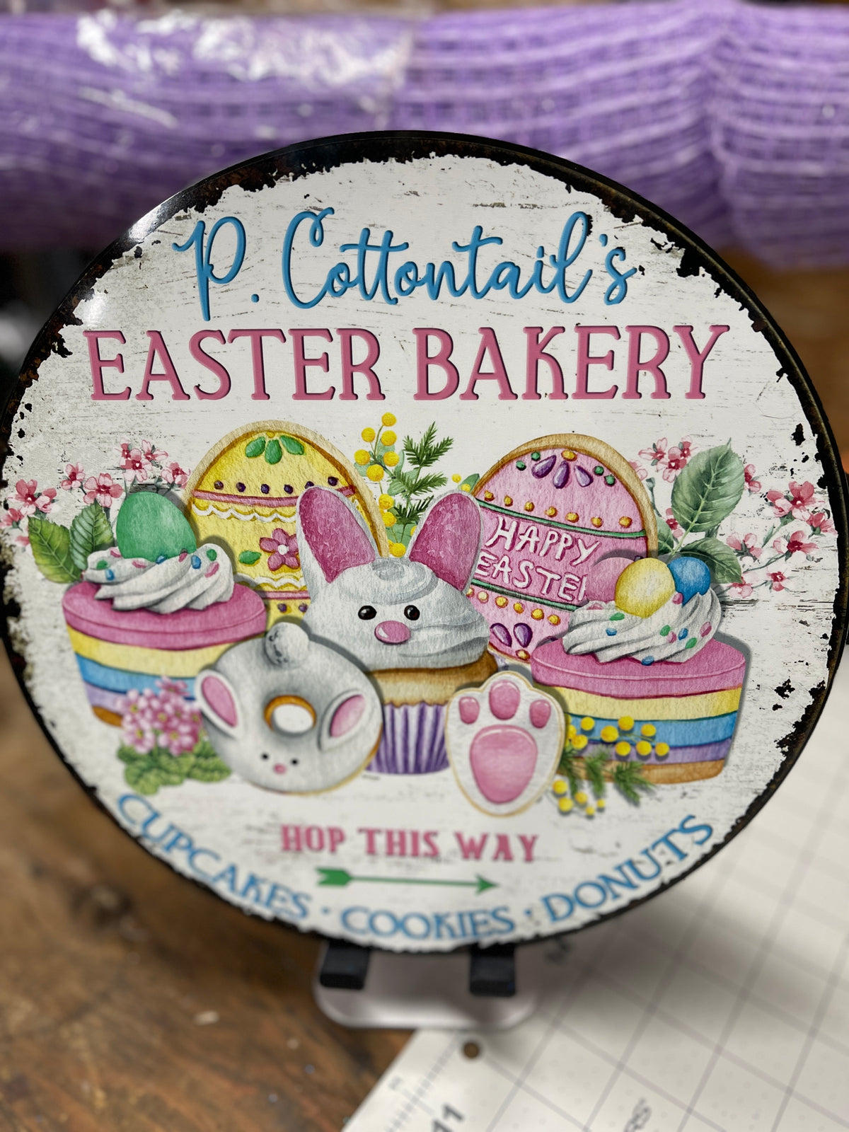 Close Up on P. Cottontails' Easter Bakery Sign, featuring Hop This Way arrow, Cupcakes, Cookies and Donuts