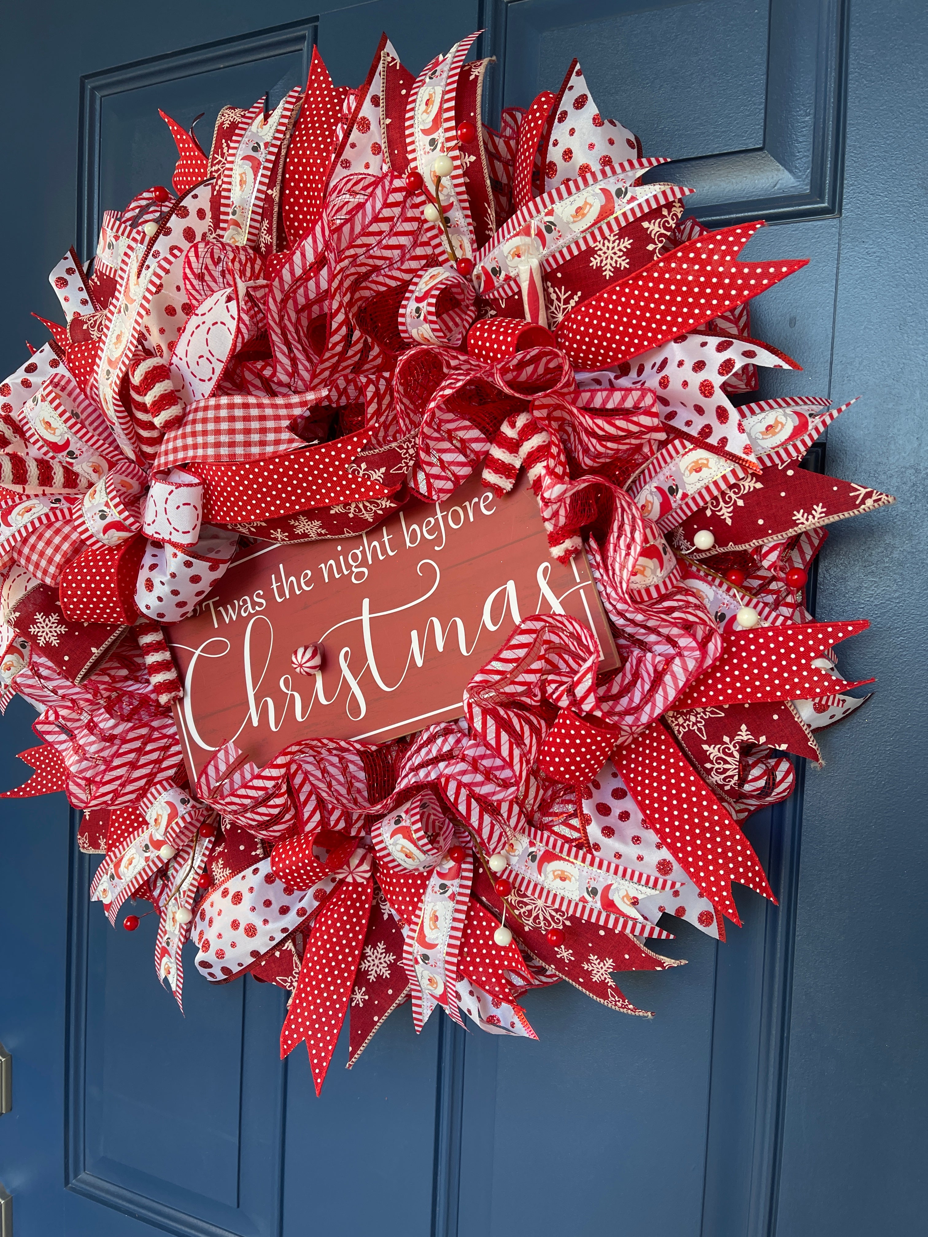 Right Side View of Red and White Twas the Night Before Christmas Wreath on a Blue Door