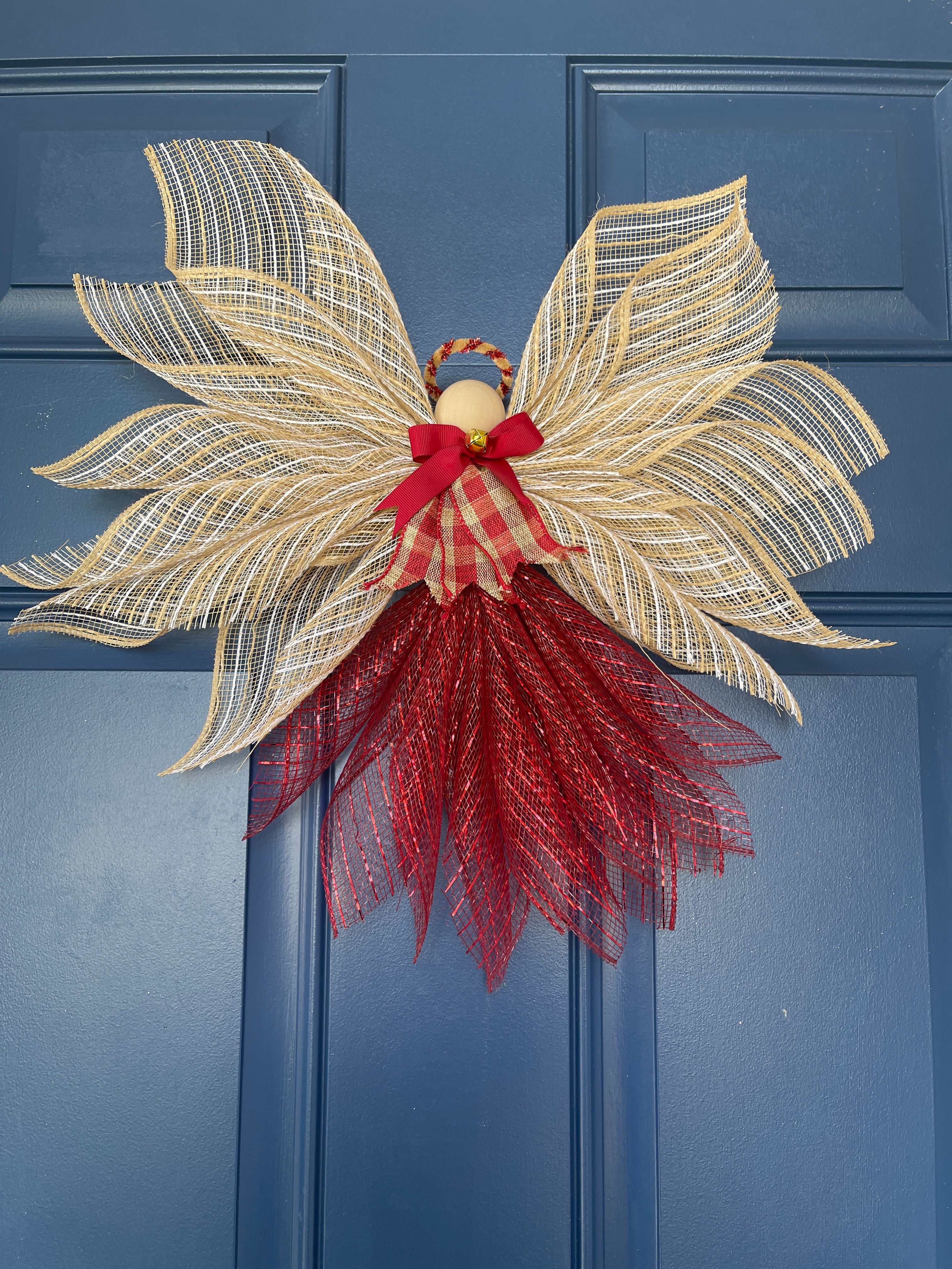 Bottom View of Rustic Farmhouse Jute Burlap and Red Metallic Angel Tree Topper with Red and Tan Plaid Apron, Red Bow, Gold Bell and Wooden Head on a Blue Door