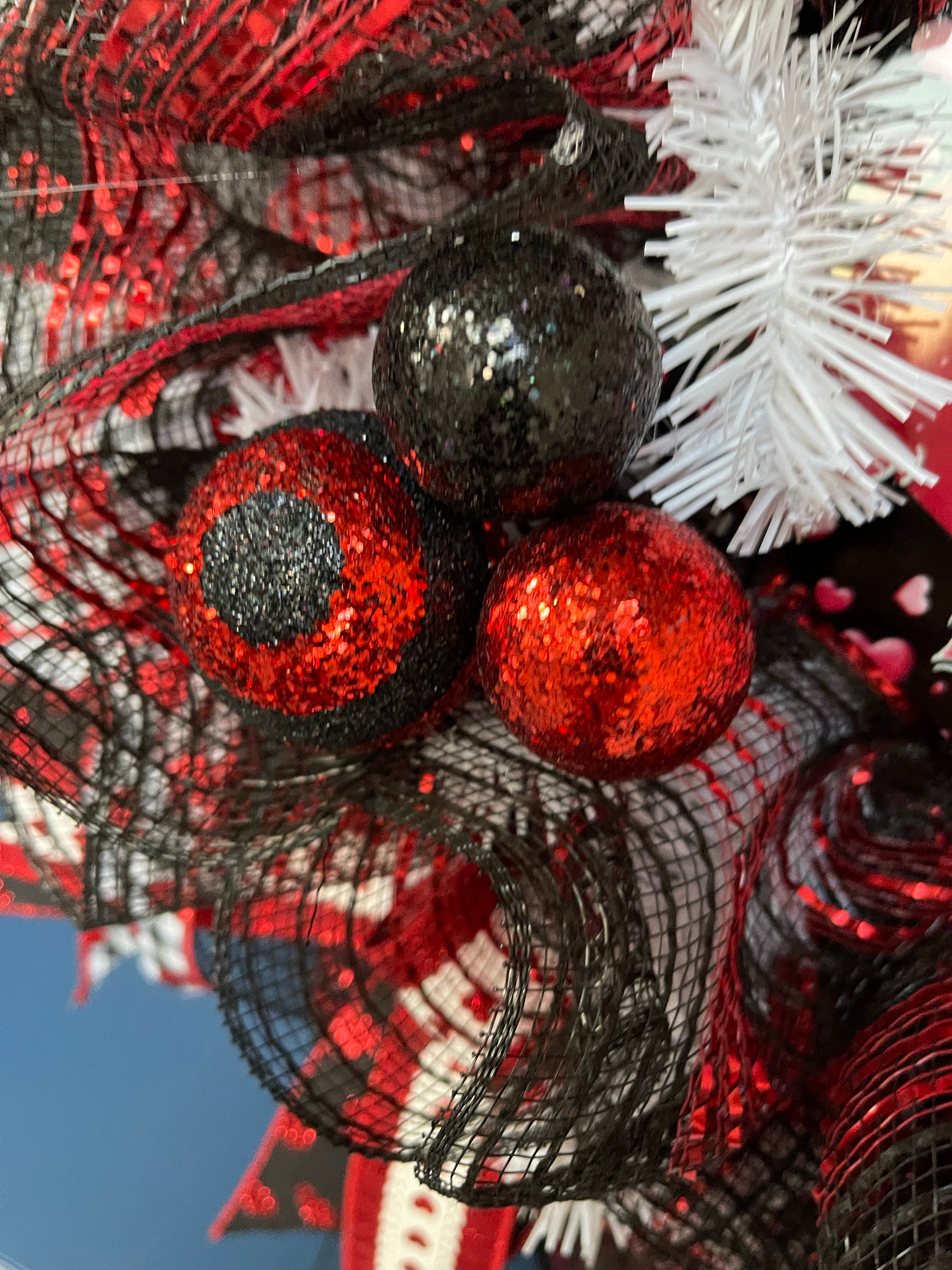 Close Up Detail of Red, Black and a Red and Black Glitter Ball 