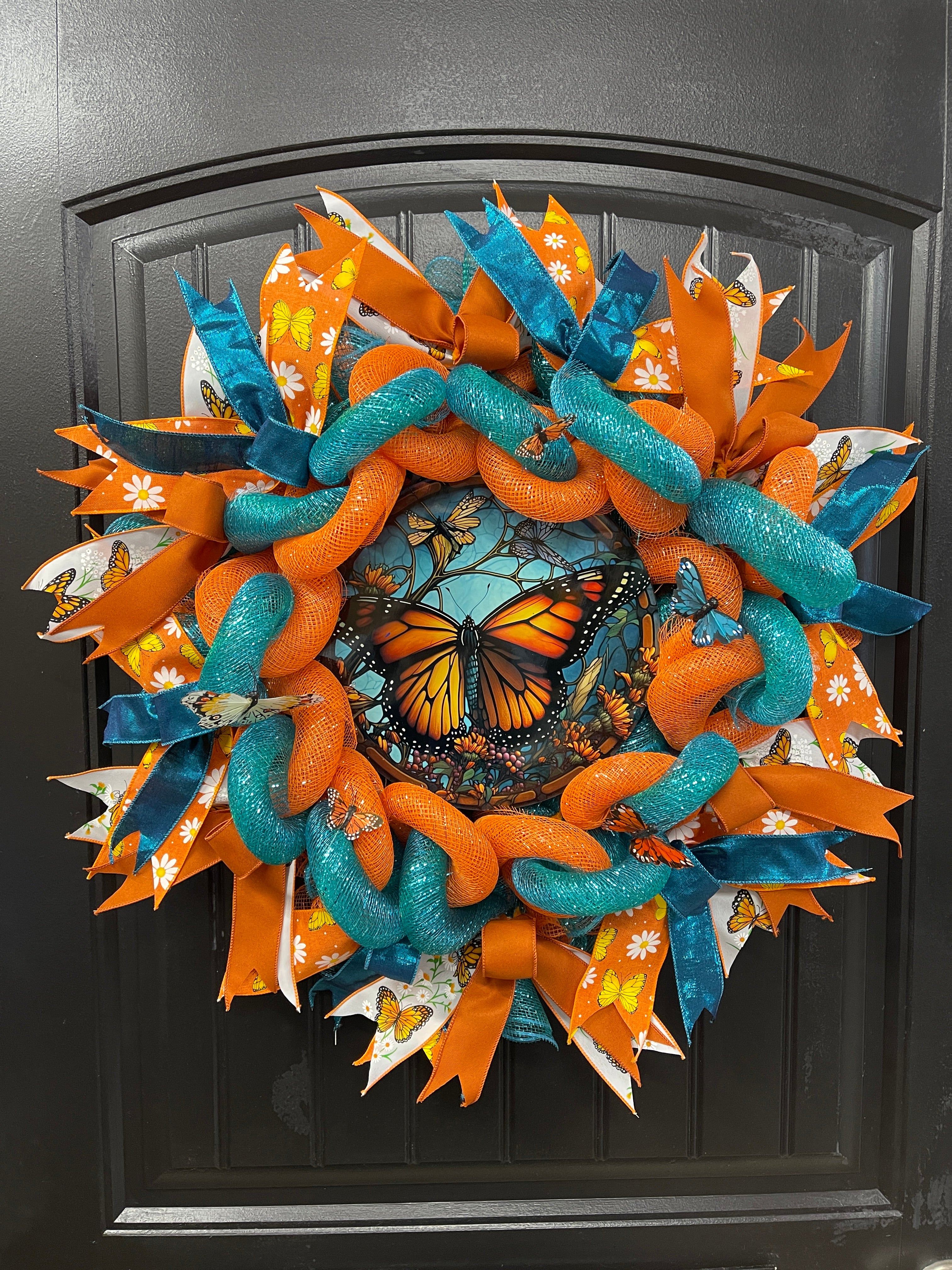 Teal and Orange Woven Monarch Butterfly Deco Mesh Spring Wreath on Black Door