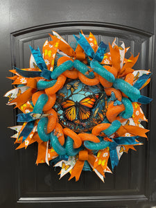 Teal and Orange Woven Monarch Butterfly Deco Mesh Spring Wreath on Black Door