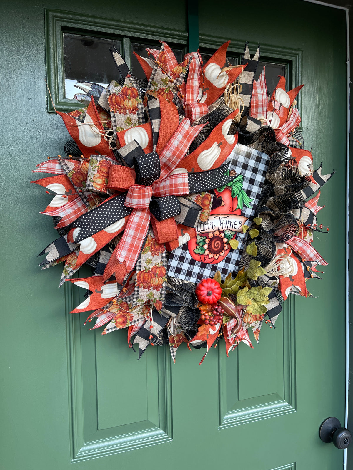 Left Side View of Black, White, Orange and Tan Deco Mesh Autumn Thyme Fall Wreath with Pumpkins on Green Door