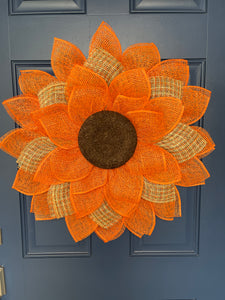 Poly Burlap Mesh Sunflower Wreath Featuring Orange and Patterned Colors of Yellow, Brown and Orange with a Brown Center on a Blue Door
