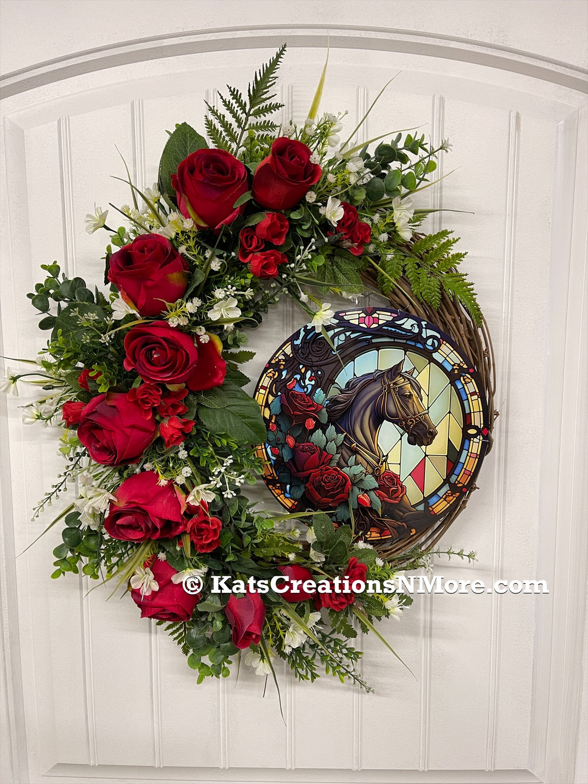 Red Roses with Green Ferns and White Babies Breath Kentucky Derby Run for the Race Wreath with round simulated stained glass sign on a White Door