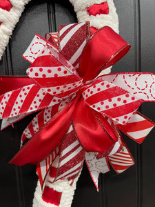 Red and White Striped Bow for  Red and White Candy Cane Chenille Yarn and Ribbon Christmas Wreath with Red and White Striped Bow for Front Door. 