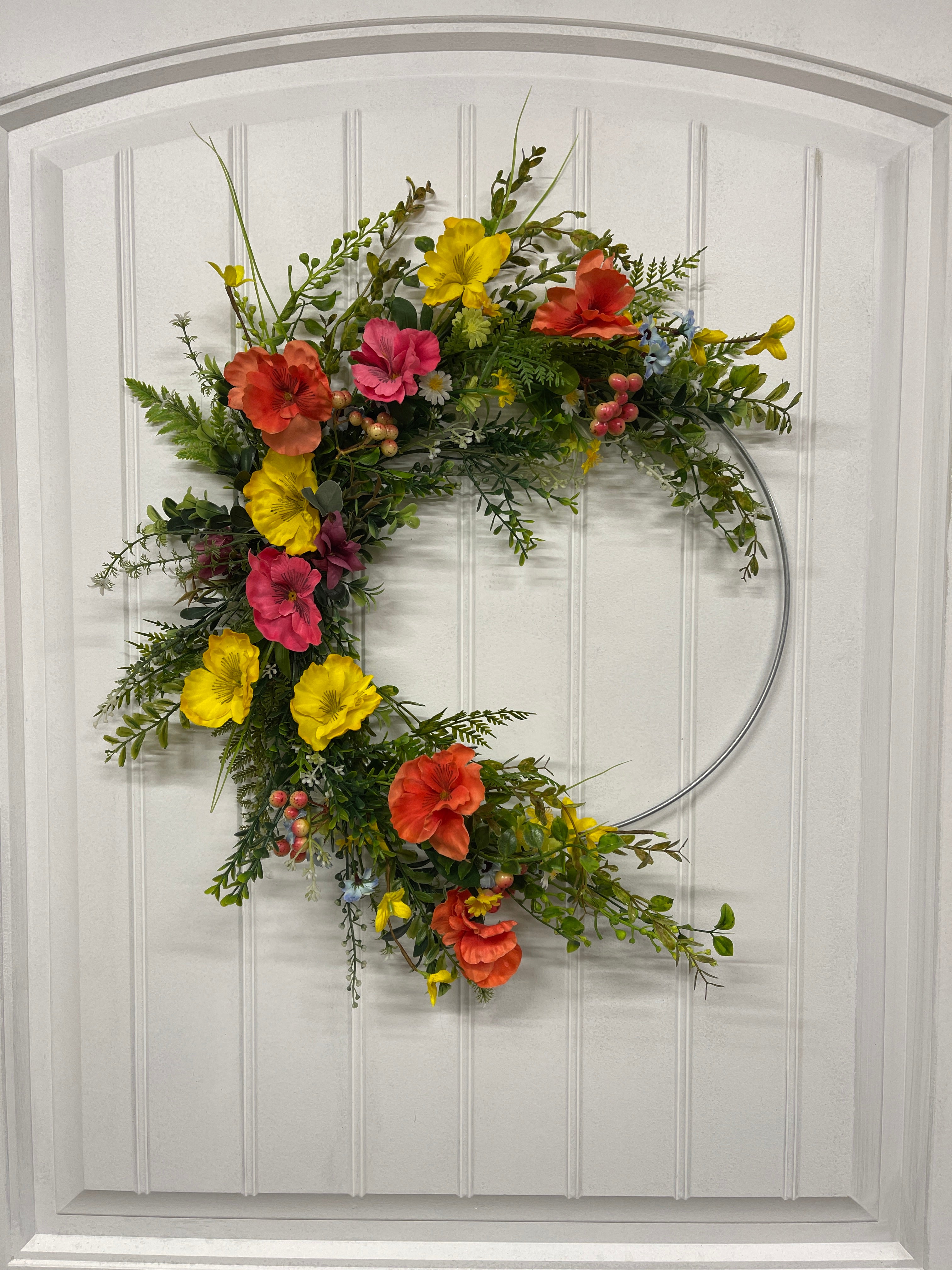 Orange, Pink and Yellow Cosmos Florals with Meadow Greens on a Silver Hoop Wreath on a White Door