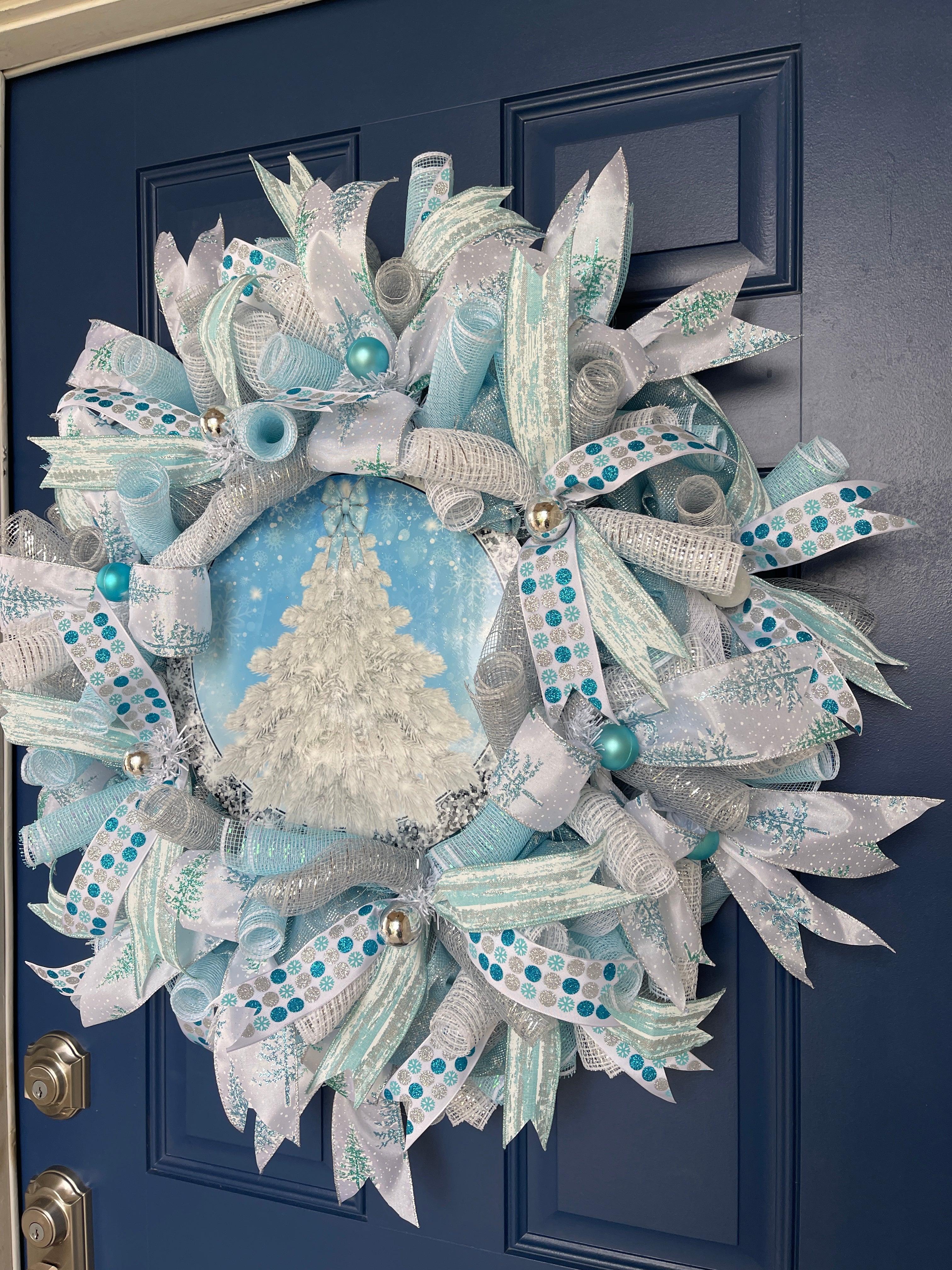 Right Side View of Blue and White Deco Mesh Winter Christmas Tree Wreath on a Blue Door 
