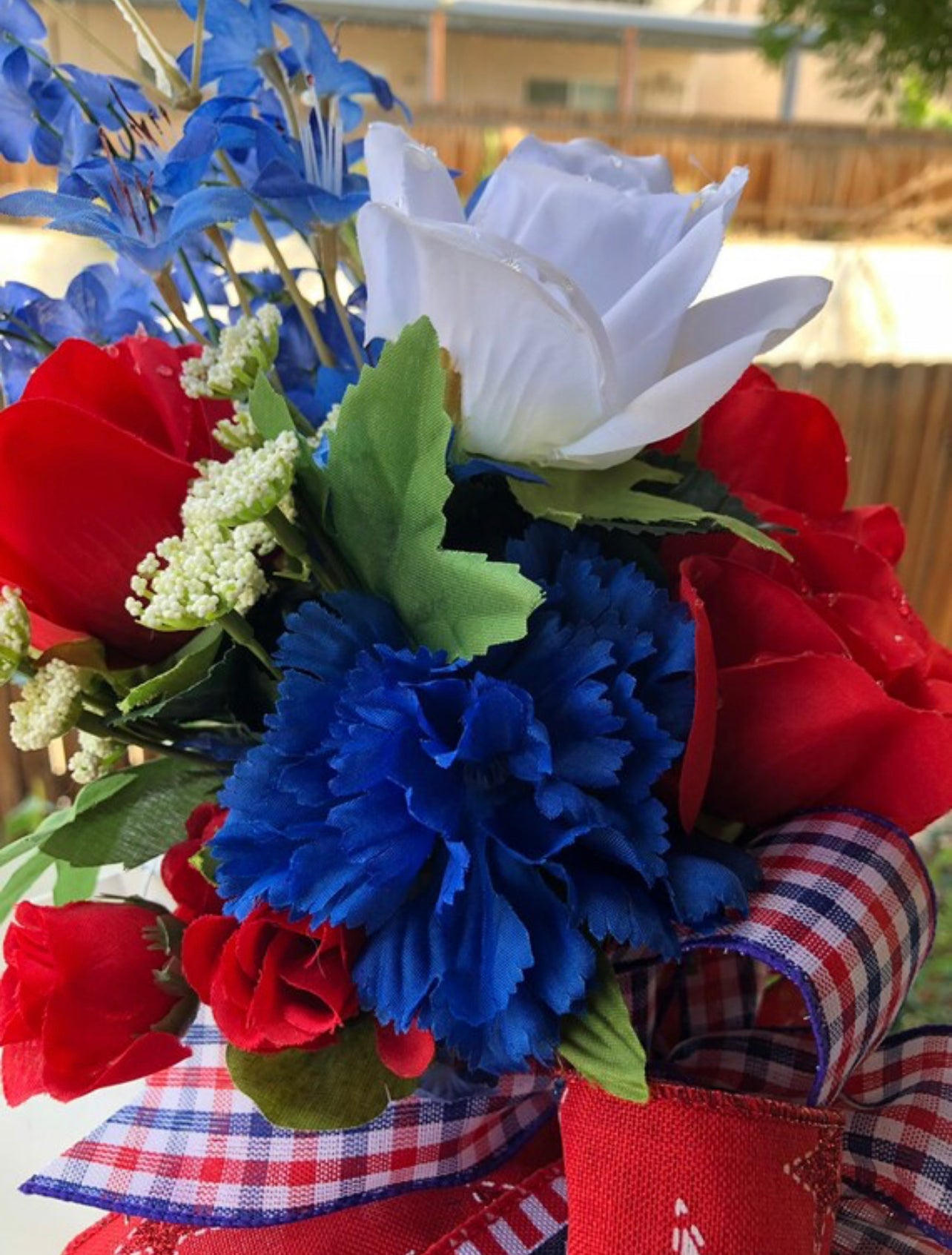 Close Up Detail of Red and White Roses with Blue Cornflowers