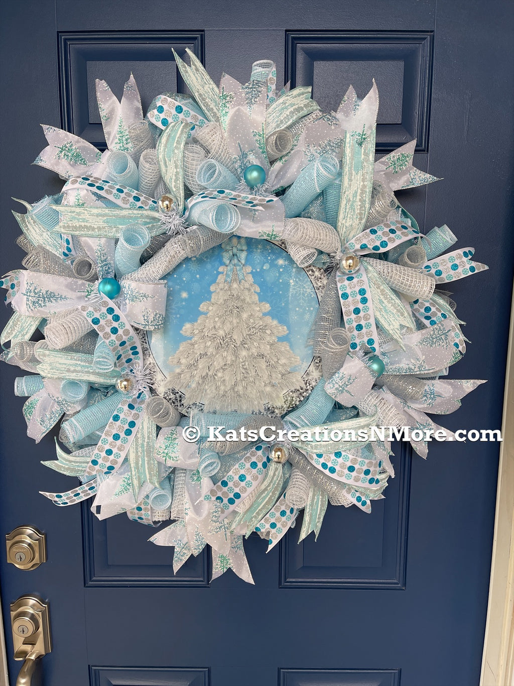 Blue and White Deco Mesh Winter Christmas Tree Wreath on a Blue Door 