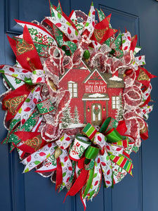 Left Side View of Red, White and Green Home for the Holidays Christmas Deco Mesh Wreath on a Blue Front Door