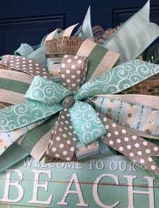 closeup of the ribbon on the beach house welcome wreath