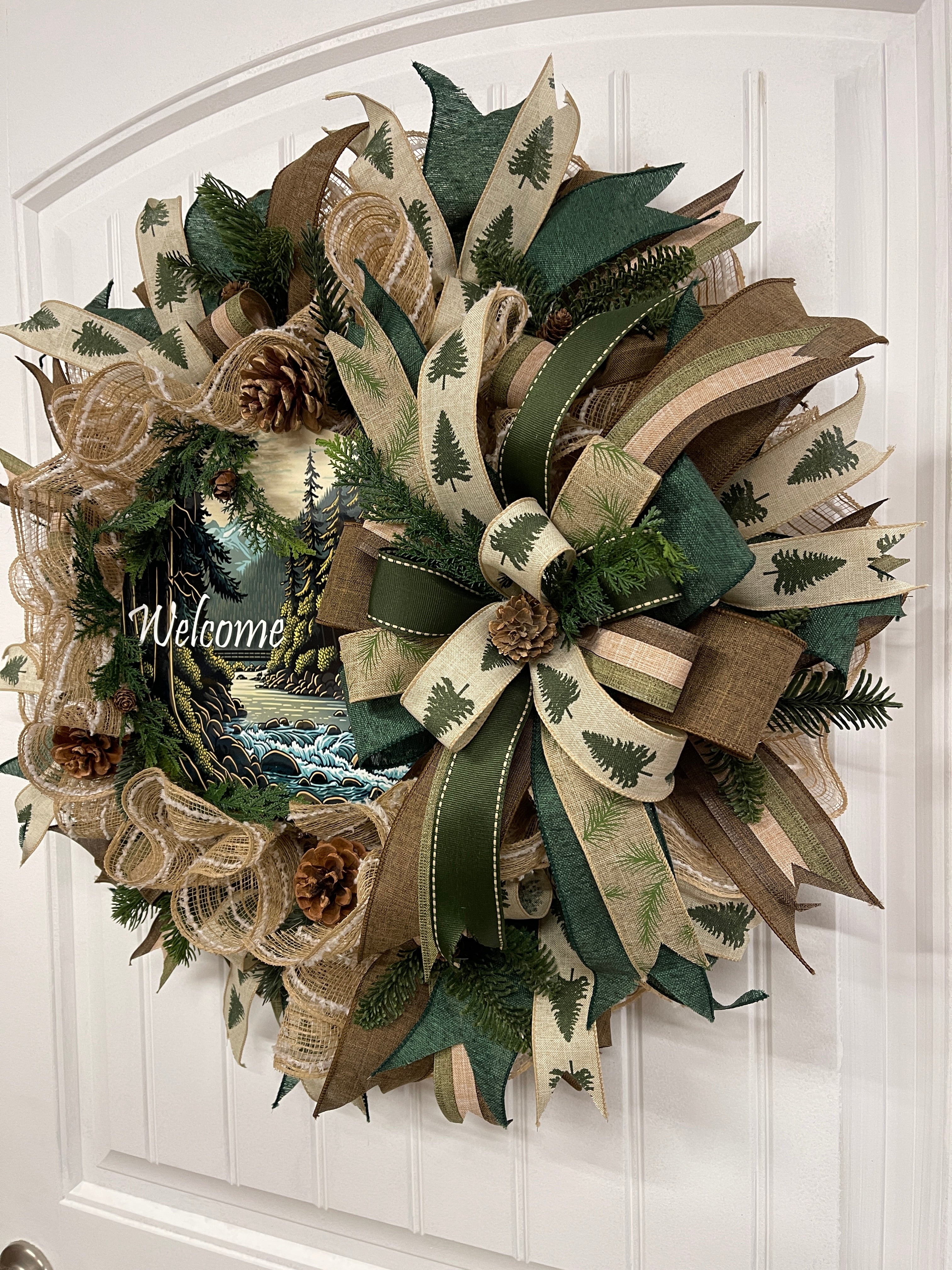 Right Side View of Pine and Pinecone, Green, Tan and Brown, Forest Mountain Cabin Welcome Wreath on a White Door