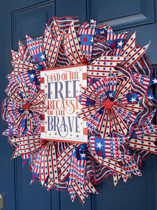 Right Side View of Red, White and Blue Stars and Stripes Storm Door Land of the Free Because of the Brave Wreath on a Blue Door