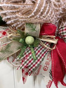 Close Up of Green Speckled Egg, Pine Branches, Noel Green Ribbon and Natural Raffia on a Country Chicken Christmas Wreath