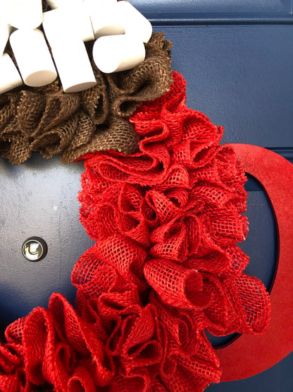 Close up of Red and Brown Burlap, Red Wood Cup Handle and White Foam Marshmallows. 