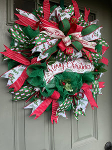 Left Side View of Red, White and Green Merry Christmas Deco Mesh Wreath on a Green Door
