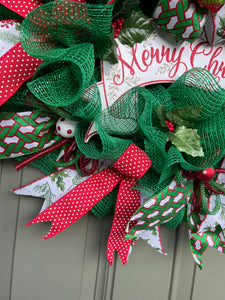Close Up Details of Ribbons on the Edge of the Merry Christmas Wreath with Balls of White with Red and Green Polka Dots, Red Ribbon with White Polka Dots, Red and Green Flex Tubing and Mistletoe printed ribbons 