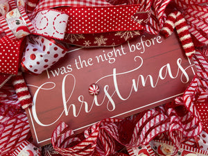 Close Up of Twas the Night Before Christmas Sign with Peppermint on Christmas Wreath